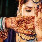 A bride showing her beautiful mehndi dress