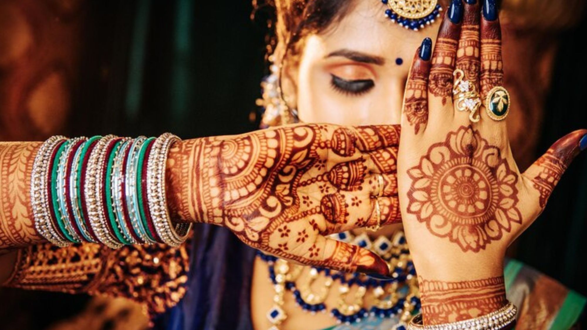 A bride showing her beautiful mehndi dress