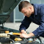 auto mechanic doing car maintenance