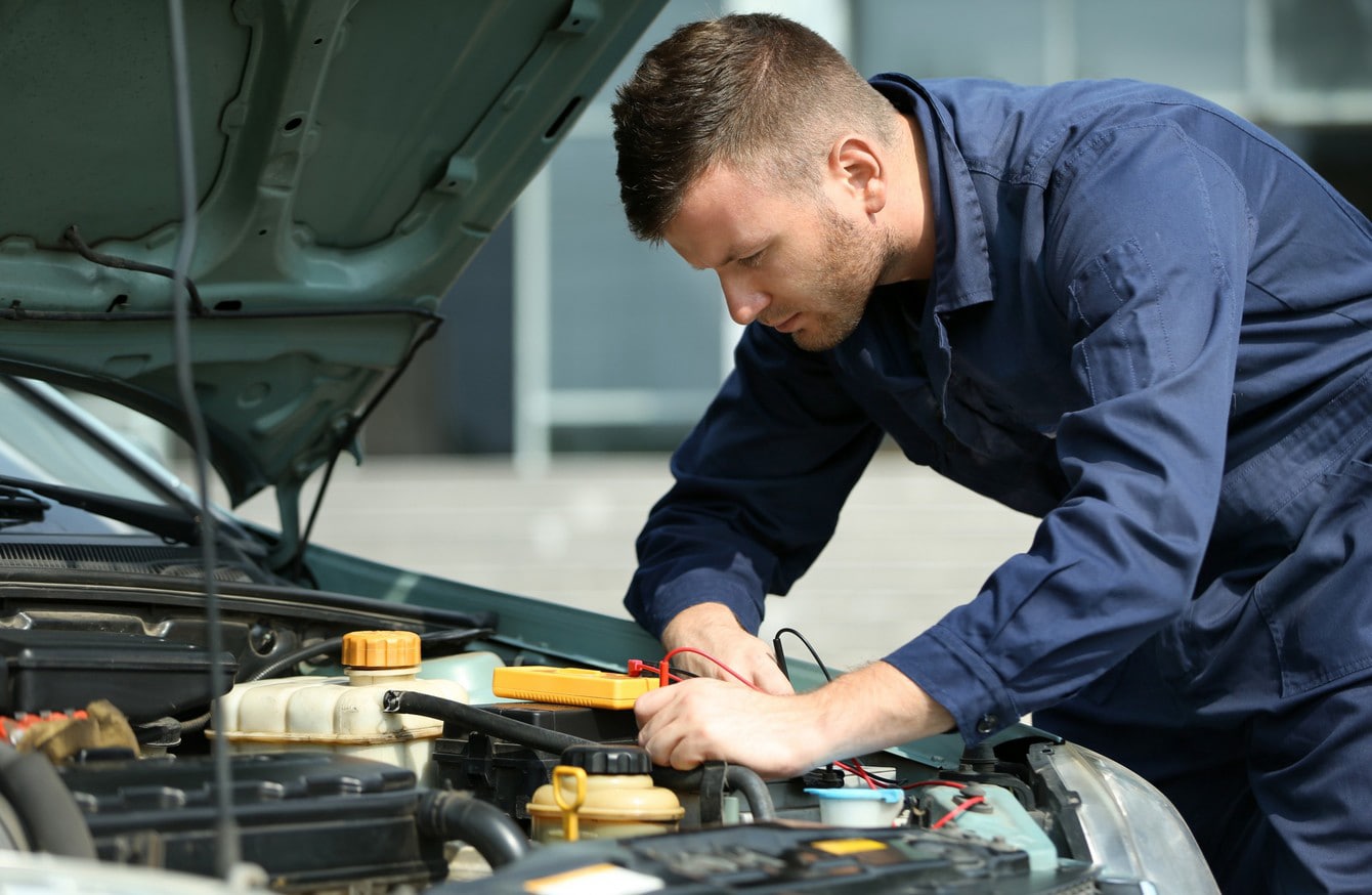 auto mechanic doing car maintenance